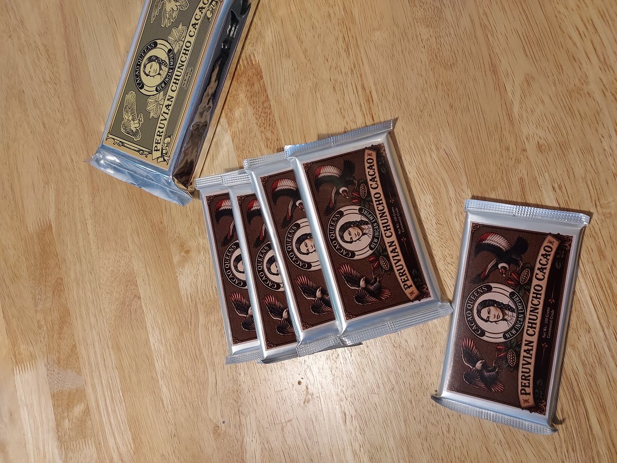 Four foil-wrapped bars of 100% Chuncho cacao, two of them still in their printed boxes.
