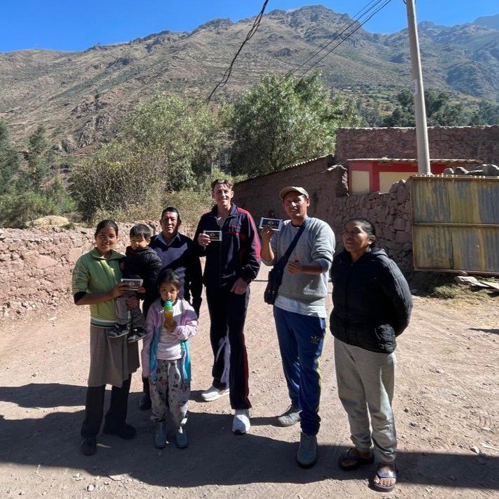 Austin's wife's extended family outside their home in the high jungle